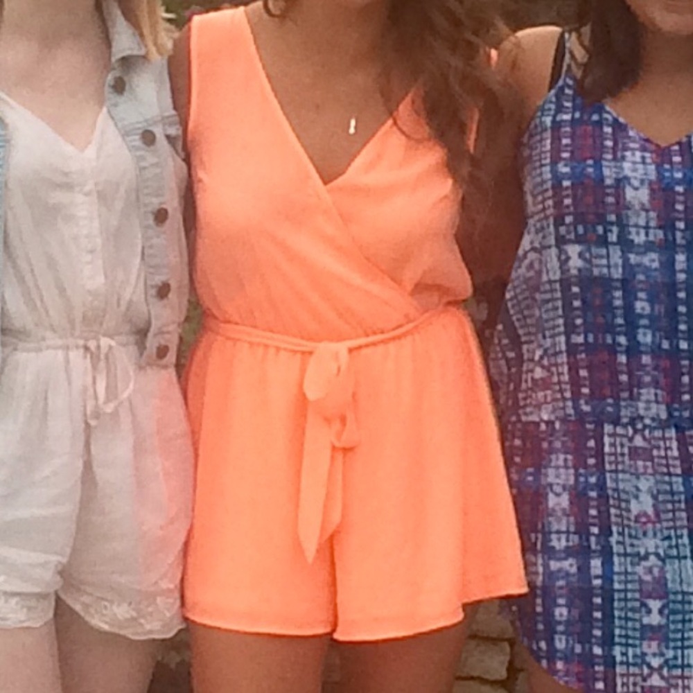 Coral romper with tie around waist